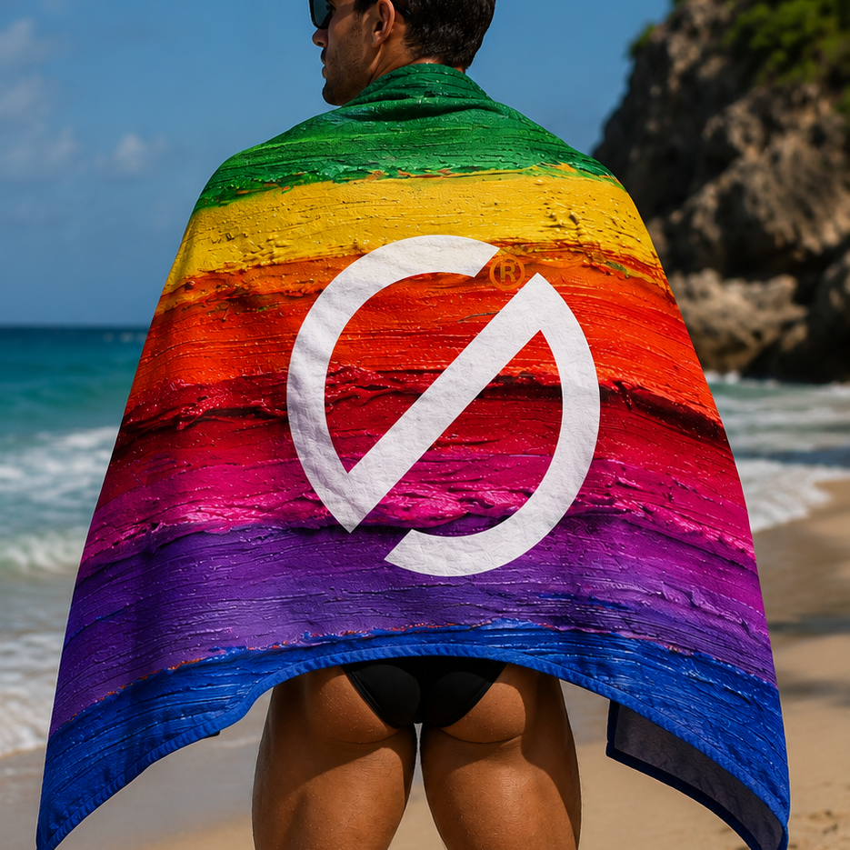 Man on the beach wearing the SUG WEAR  Pride 2026 towel